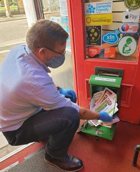 Cllr Mike Isherwood emptying 60 second survey collection box